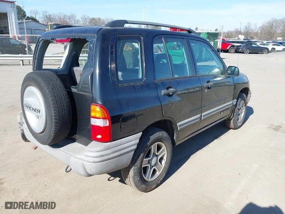 2003 Chevrolet Tracker with VIN 2CNBE13C736921273, listed as a IAAI auction lot 41453815 with NaN miles. Bid and sale history available at carsss.com. Image 4.