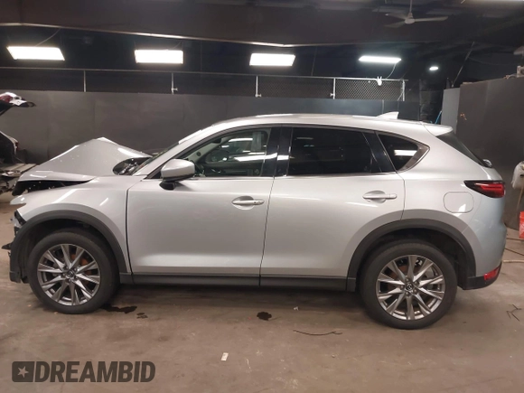 2021 Mazda CX-5 Grand Touring with VIN JM3KFBDM7M1392644, listed as a IAAI auction lot 41824612 with 80,000 mi miles and . Bid and sale history available at DreamBid. Image 13.