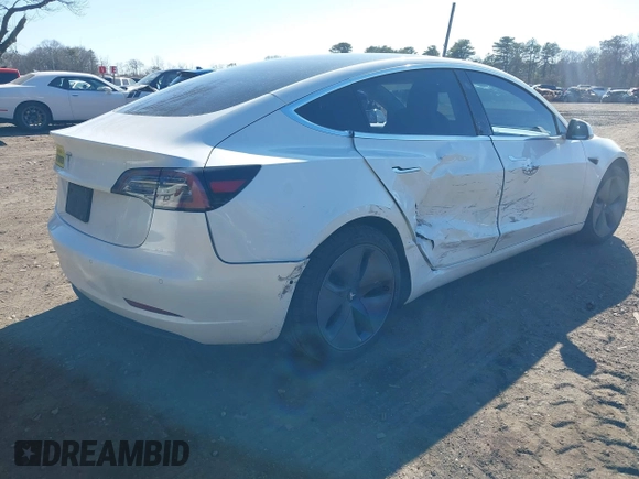 2020 Tesla Model 3 Standard Range Plus with VIN 5YJ3E1EA0LF783672, listed as a IAAI auction lot 41903431 with 52,157 mi miles and . Bid and sale history available at carsss.com. Image 6.