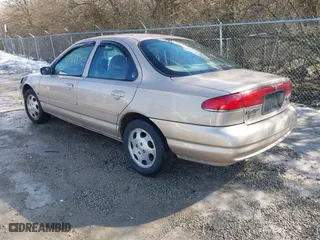 1999 Mercury Mystique GS with VIN 1MEFM6530XK635463, listed as a IAAI auction lot 41478903 with 87,911 mi miles. Bid and sale history available at carsss.com. Image 3.