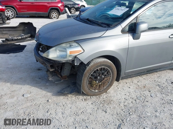 2012 Nissan Versa S with VIN 3N1BC1CP8CK242212, listed as a IAAI auction lot 42027327 with 117,118 mi miles. Bid and sale history available at carsss.com. Image 6.
