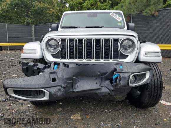2024 Jeep Wrangler Sahara with VIN 1C4RJXP65RW210689, listed as a Copart auction lot 66482724 with 4,872 mi miles and Salvage Title. Bid and sale history available at DreamBid. Image 5.