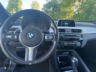 2018 BMW X1 xDrive28i with VIN WBXHT3C33J5K24081, listed as a Copart auction lot 55887425 with 178,946 mi miles and Clean Title. Bid and sale history available at carsss.com. Image 9.