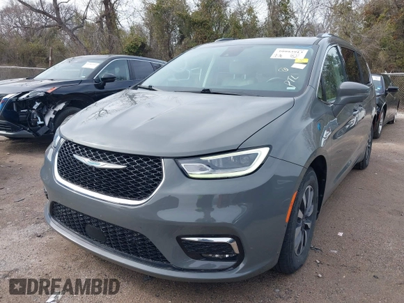2021 Chrysler Pacifica Hybrid Touring L z VIN 2C4RC1L78MR596371, wystawiony jako IAAI lot #39993913 z przebiegiem 64 830 mil mil oraz . Historia ofert i sprzedaży dostępna na DreamBid. Obrazek 17.