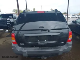 2004 Jeep Grand Cherokee Laredo with VIN 1J4GX48N94C435700, listed as a IAAI auction lot 41809624 with 147,413 mi miles. Bid and sale history available at carsss.com. Image 16.