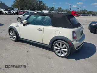 2013 MINI Convertible S with VIN WMWZP3C51DT297843, listed as a IAAI auction lot 41527353 with 127,827 mi miles and . Bid and sale history available at DreamBid. Image 3.