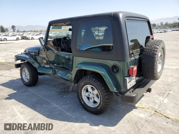 2000 Jeep Wrangler Sahara z VIN 1J4FA59S1YP746043, wystawiony jako Copart lot #58842665 z przebiegiem 148 348 mil mil oraz Szkoda całkowita • Salvage title. Historia ofert i sprzedaży dostępna na DreamBid. Obrazek 2.