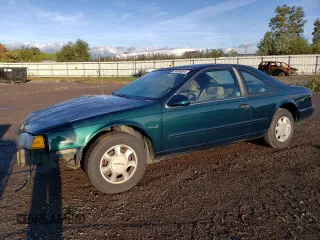 1995 Ford Thunderbird LX with VIN 1FALP6248SH176946, listed as a Copart auction lot 74066554 with 72,666 mi miles and Salvage Title. Bid and sale history available at DreamBid. Image 1.