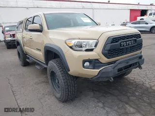 2016 Toyota Tacoma SR with VIN 3TMCZ5AN1GM018850, listed as a IAAI auction lot 41884584 with 65,634 mi miles. Bid and sale history available at carsss.com. Image 1.