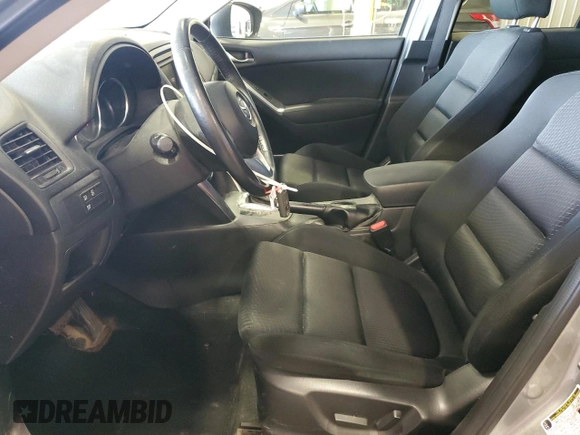 2014 Mazda CX-5 Touring z VIN JM3KE4CY5E0393463, wystawiony jako Copart lot #57776665 z przebiegiem 91 565 mil mil oraz Szkoda całkowita • Salvage title. Historia ofert i sprzedaży dostępna na DreamBid. Obrazek 7.