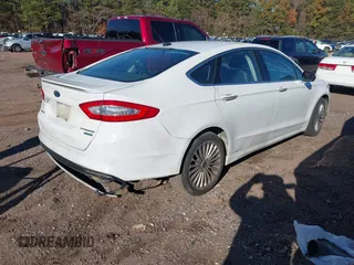 2016 Ford Fusion Titanium with VIN 3FA6P0K98GR150939, listed as a IAAI auction lot 40994523 with 144,051 mi miles. Bid and sale history available at carsss.com. Image 4.