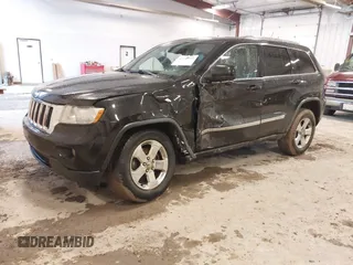 2012 Jeep Grand Cherokee Laredo with VIN 1C4RJFAT1CC225479, listed as a IAAI auction lot 41709911 with 227,150 mi miles. Bid and sale history available at carsss.com. Image 2.