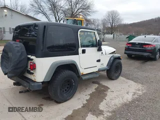 2005 Jeep Wrangler Sport with VIN 1J4FA49S25P352170, listed as a IAAI auction lot 41794958 with 154,304 mi miles. Bid and sale history available at carsss.com. Image 4.