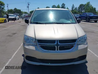 2015 Dodge Grand Caravan American Value with VIN 2C4RDGBG3FR647957, listed as a IAAI auction lot 42147813 with 129,859 mi miles and . Bid and sale history available at DreamBid. Image 6.