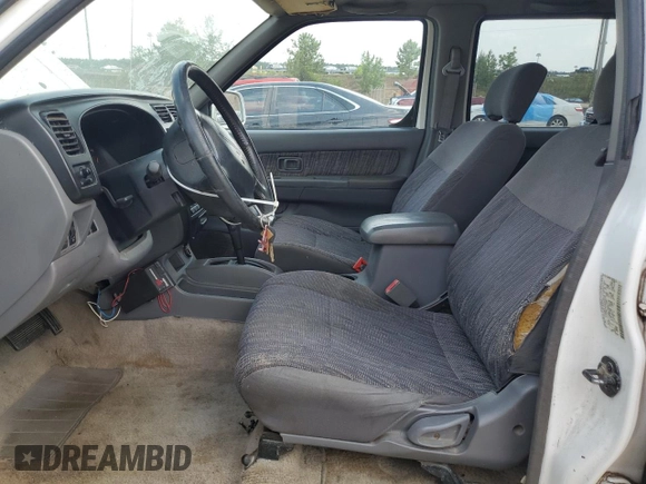 2000 Nissan Frontier XE with VIN 1N6ED27T1YC385792, listed as a Copart auction lot 62268225 with 291,906 mi miles and Salvage title. Bid and sale history available at DreamBid. Image 7.