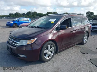 2011 Honda Odyssey Touring with VIN 5FNRL5H97BB008759, listed as a IAAI auction lot 41567010 with 215,709 mi miles. Bid and sale history available at carsss.com. Image 17.