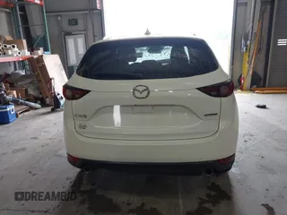 2020 Mazda CX-5 Grand Touring with VIN JM3KFADMXL0742038, listed as a IAAI auction lot 42292400 with 68,339 mi miles and . Bid and sale history available at DreamBid. Image 17.