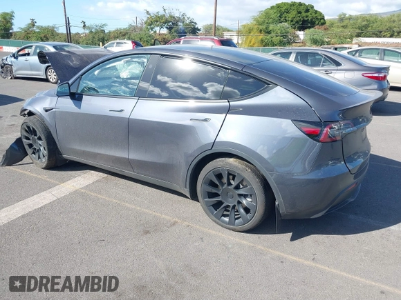 2023 Tesla Model Y Long Range z VIN 7SAYGAEE4PF945847, wystawiony jako IAAI lot #41071924 z przebiegiem 33 454 mil mil oraz . Historia ofert i sprzedaży dostępna na DreamBid. Obrazek 3.
