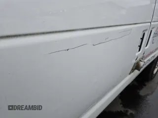 2012 Ford Econoline Cargo Commercial with VIN 1FTNE2EL1CDB12857, listed as a IAAI auction lot 42234010 with 242,380 mi miles. Bid and sale history available at carsss.com. Image 1.