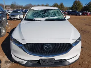 2020 Mazda CX-5 Touring with VIN JM3KFBCM0L0828207, listed as a IAAI auction lot 41305801 with 56,500 mi miles and . Bid and sale history available at DreamBid. Image 12.