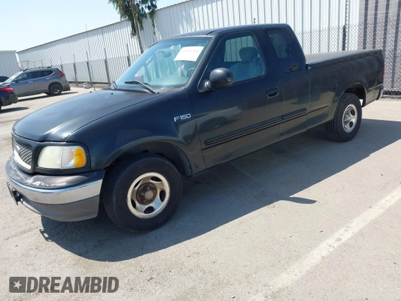 2003 Ford F-150 XL with VIN 1FTRX17213NB70553, listed as a IAAI auction lot 41946968 with 186,683 mi miles. Bid and sale history available at carsss.com. Image 2.