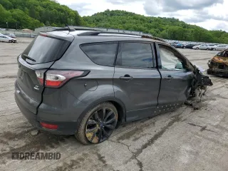2017 Ford Escape SE z VIN 1FMCU9GD7HUB76204, wystawiony jako Copart lot #58334725 z przebiegiem Nie podano mil oraz Szkoda całkowita • Salvage title. Historia ofert i sprzedaży dostępna na DreamBid. Obrazek 3.