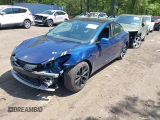 2022 Tesla Model 3 Long Range z VIN 5YJ3E1EB7NF180049, wystawiony jako IAAI lot #42188963 z przebiegiem 18 604 mil mil oraz . Historia ofert i sprzedaży dostępna na DreamBid. Obrazek 2.
