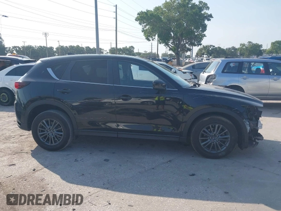 2020 Mazda CX-5 Touring with VIN JM3KFACM2L0770241, listed as a IAAI auction lot 42186952 with 41,590 mi miles and . Bid and sale history available at DreamBid. Image 14.