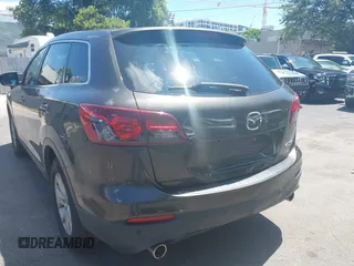 2015 Mazda CX-9 Touring z VIN JM3TB2CV1F0458995, wystawiony jako IAAI lot #42523344 z przebiegiem 130 763 mil mil oraz . Historia ofert i sprzedaży dostępna na DreamBid. Obrazek 6.