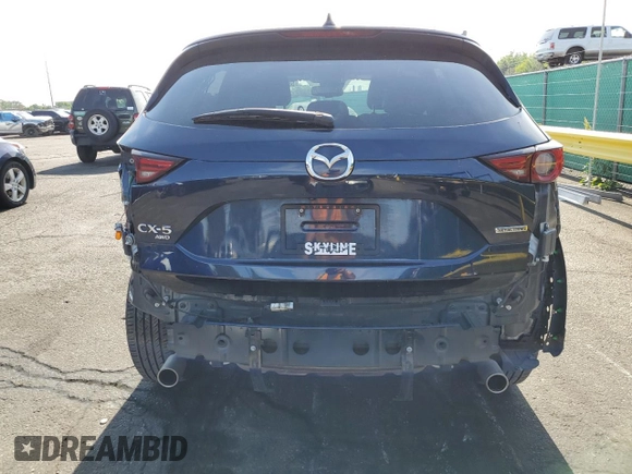 2021 Mazda CX-5 Grand Touring with VIN JM3KFBDM3M1344784, listed as a Copart auction lot 58051445 with 69,593 mi miles and Salvage title. Bid and sale history available at DreamBid. Image 6.