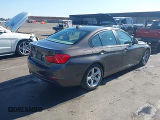 2014 BMW 3 Series 328i with VIN WBA3C1C57EK116483, listed as a IAAI auction lot 42697759 with 113,010 mi miles and . Bid and sale history available at DreamBid. Image 4.