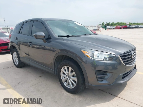 2016 Mazda CX-5 Sport with VIN JM3KE4BY8G0921243, listed as a IAAI auction lot 42102663 with 111,960 mi miles and . Bid and sale history available at DreamBid. Image 1.