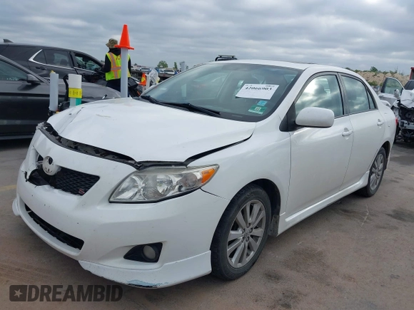 2010 Toyota Corolla with VIN 2T1BU4EEXAC521114, listed as a IAAI auction lot 42066903 with 208,509 mi miles. Bid and sale history available at carsss.com. Image 2.