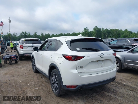 2018 Mazda CX-5 Grand Touring with VIN JM3KFBDM0J0308813, listed as a IAAI auction lot 42657978 with 78,119 mi miles and . Bid and sale history available at DreamBid. Image 3.