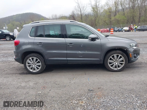 2013 Volkswagen Tiguan SE with VIN WVGAV7AX9DW547633, listed as a IAAI auction lot 42009704 with 51,826 mi miles and . Bid and sale history available at DreamBid. Image 13.