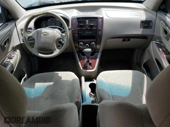 2005 Hyundai Tucson GL with VIN KM8JM12B05U148660, listed as a Copart auction lot 54302805 with 257,233 mi miles and Salvage title. Bid and sale history available at DreamBid. Image 8.
