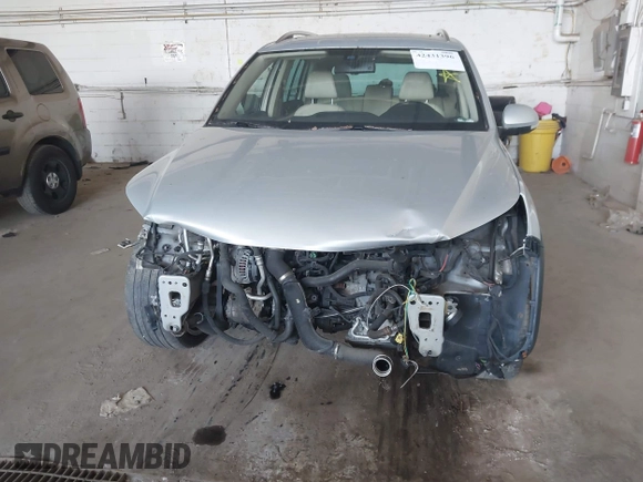 2013 Volkswagen Tiguan SEL z VIN WVGBV7AX2DW557134, wystawiony jako IAAI lot #42431396 z przebiegiem 160 692 mil mil oraz . Historia ofert i sprzedaży dostępna na DreamBid. Obrazek 6.
