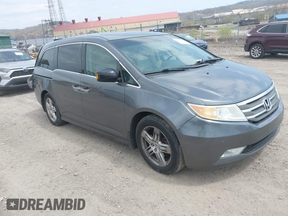 2012 Honda Odyssey Touring with VIN 5FNRL5H90CB045430, listed as a IAAI auction lot 42079770 with 113,901 mi miles and . Bid and sale history available at DreamBid. Image 1.