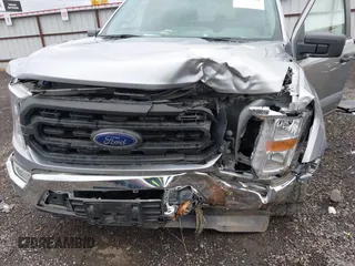 2021 Ford F-150 XL z VIN 1FTFW1E5XMFA28555, wystawiony jako IAAI lot #41814344 z przebiegiem 31 680 mil mil oraz . Historia ofert i sprzedaży dostępna na DreamBid. Obrazek 6.