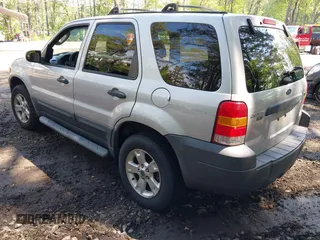2007 Ford Escape XLT with VIN 1FMCU93167KA51832, listed as a IAAI auction lot 42115125 with 148,584 mi miles. Bid and sale history available at carsss.com. Image 3.