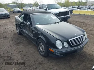 1999 Mercedes-Benz CLK with VIN WDBLK65G1XT013704, listed as a IAAI auction lot 42115880 with 85,741 mi miles. Bid and sale history available at carsss.com. Image 1.