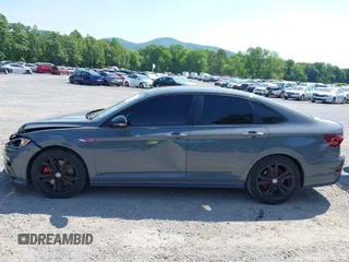 2021 Volkswagen Jetta GLI S z VIN 3VW6T7BU9MM052902, wystawiony jako IAAI lot #42286711 z przebiegiem 91 519 mil mil oraz . Historia ofert i sprzedaży dostępna na DreamBid. Obrazek 15.