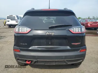 2019 Jeep Cherokee Trailhawk z VIN 1C4PJMBXXKD471338, wystawiony jako Copart lot #59880765 z przebiegiem 59 546 mil mil oraz Szkoda całkowita • Salvage title. Historia ofert i sprzedaży dostępna na DreamBid. Obrazek 6.
