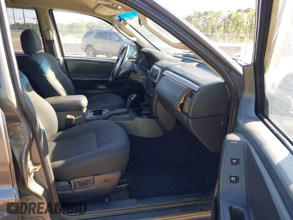 2002 Jeep Grand Cherokee z VIN 1J4GX38S32C238339, wystawiony jako IAAI lot #42653341 z przebiegiem 264 189 mil mil oraz . Historia ofert i sprzedaży dostępna na DreamBid. Obrazek 5.