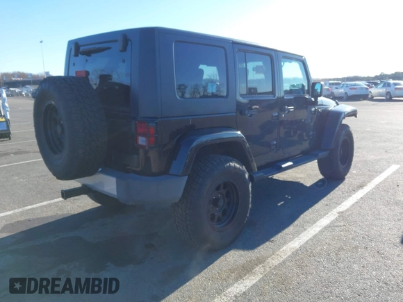 2010 Jeep Wrangler Unlimited Sahara with VIN 1J4HA5H16AL215659, listed as a IAAI auction lot 41749218 with 55,544 mi miles. Bid and sale history available at carsss.com. Image 4.