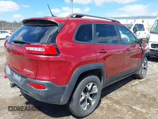 2015 Jeep Cherokee Trailhawk with VIN 1C4PJMBS0FW728361, listed as a IAAI auction lot 41978853 with 123,127 mi miles. Bid and sale history available at carsss.com. Image 4.