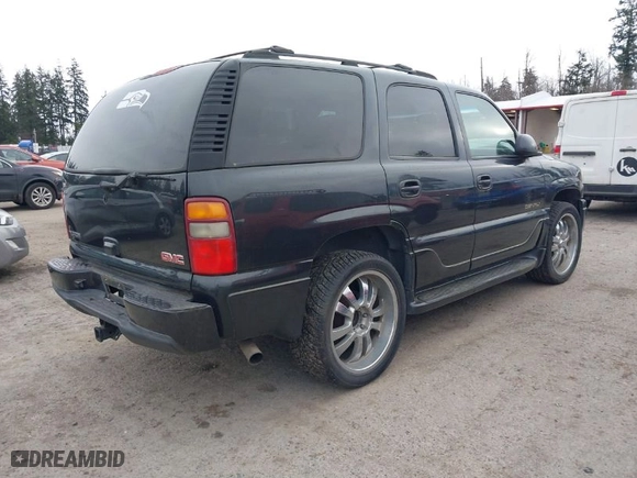 2003 GMC Yukon Denali with VIN 1GKEK63U73J310098, listed as a IAAI auction lot 41831615 with 262,134 mi miles. Bid and sale history available at carsss.com. Image 4.
