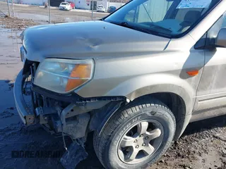 2007 Honda Pilot EX with VIN 2HKYF184X7H534943, listed as a IAAI auction lot 41818741 with 220,151 mi miles. Bid and sale history available at carsss.com. Image 12.