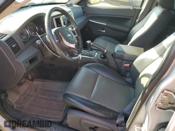 2009 Jeep Grand Cherokee Laredo with VIN 1J8HR48P39C559192, listed as a Copart auction lot 74007094 with 105,997 mi miles and Salvage Title. Bid and sale history available at carsss.com. Image 7.