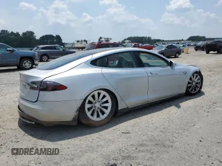 2013 Tesla Model S с VIN 5YJSA1DNXDFP04134, выставлен на аукционе Copart как лот 62660125 с пробегом 150 560 миль миль и Чистый • Clean title. История ставок и продаж доступна на DreamBid. Изображение 3.